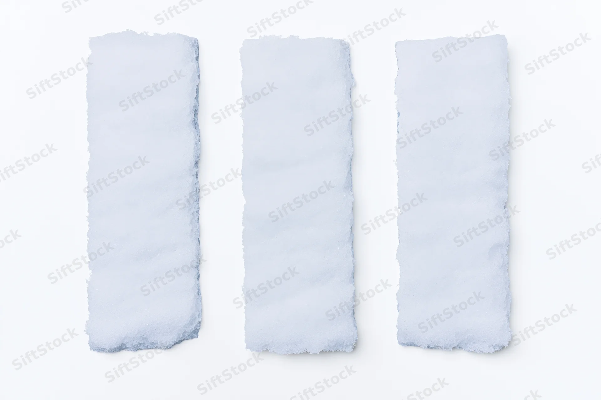 Three elongated snow drifts arranged in a row on a white background