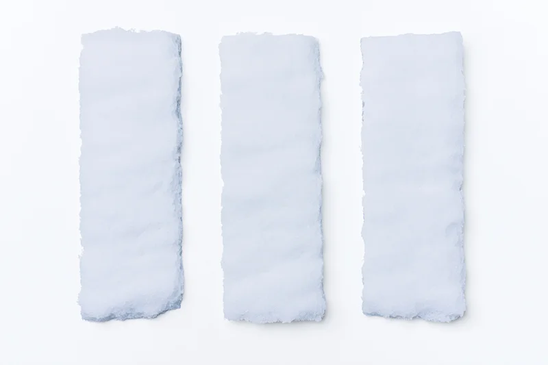 Three elongated snow drifts arranged in a row on a white background