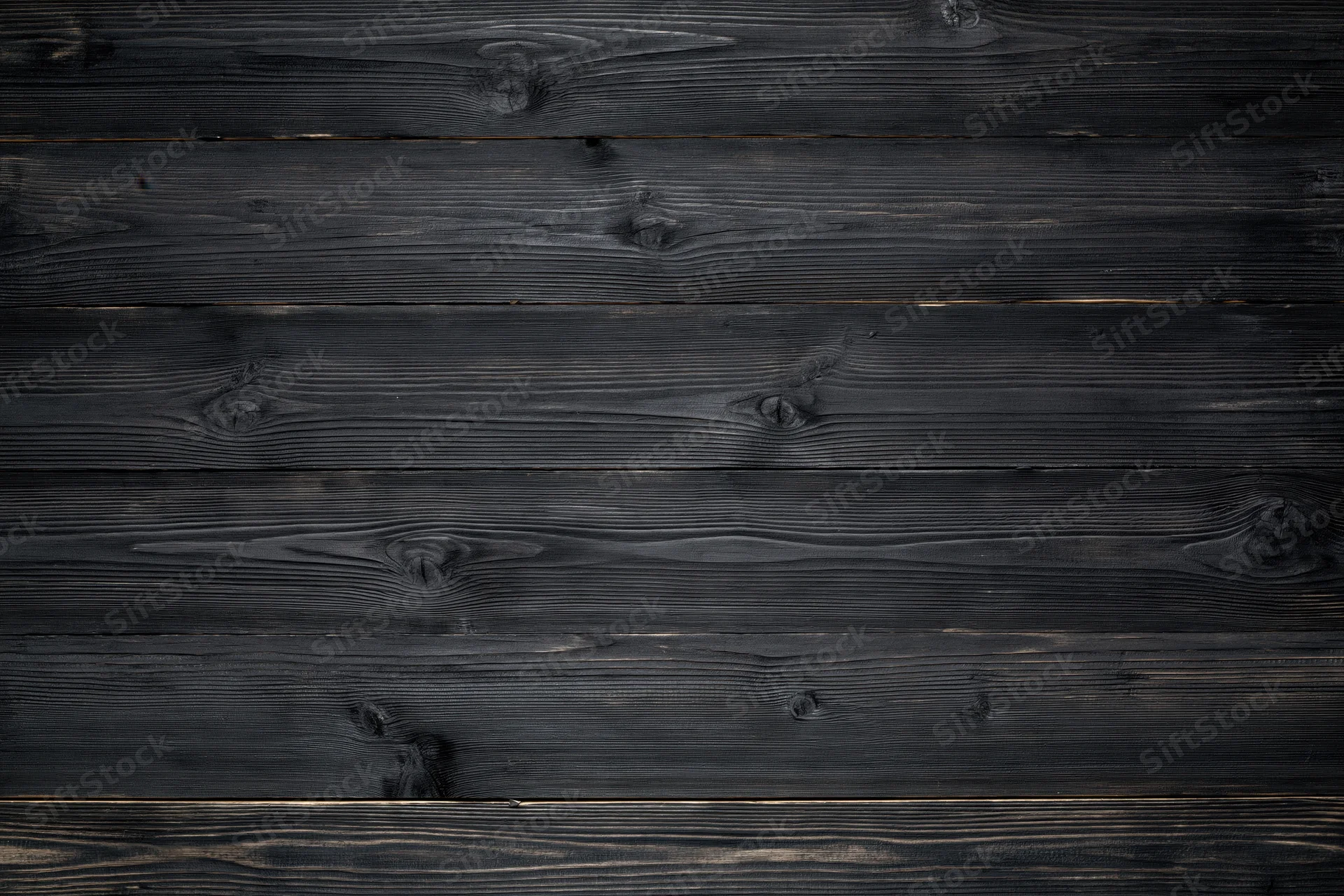 Horizontal dark charcoal weathered wooden planks forming a textured surface