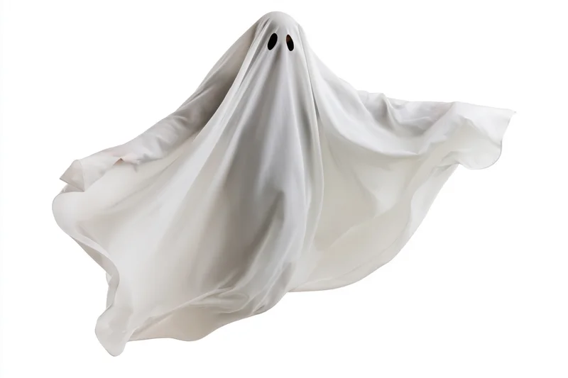 Ghost in white sheet costume floating against white background