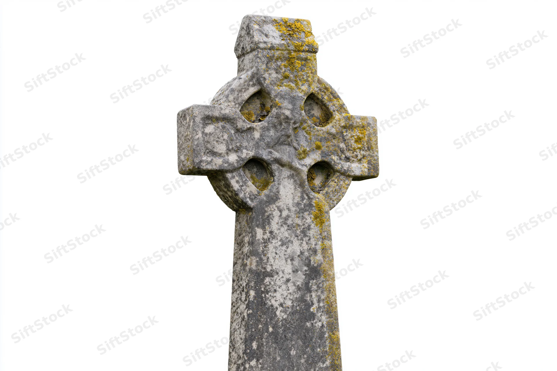 Ancient celtic stone cross gravestone with lichen and weathering isolated on white
