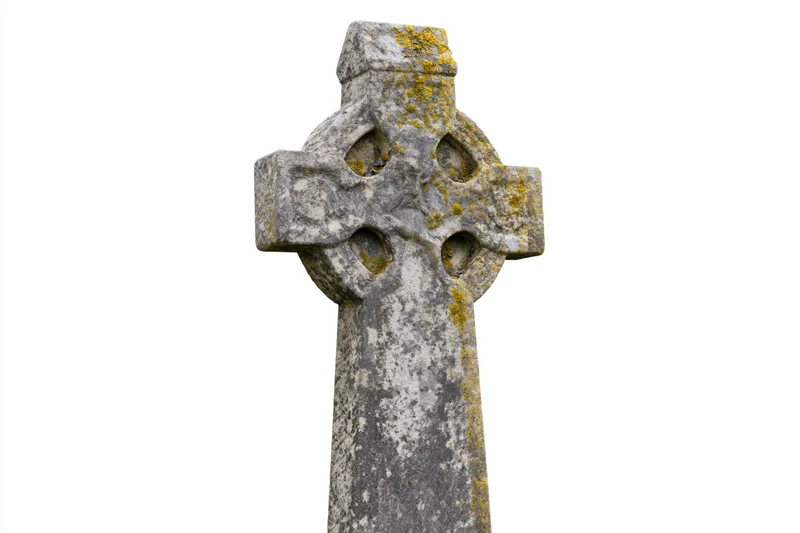 Ancient celtic stone cross gravestone with lichen and weathering isolated on white