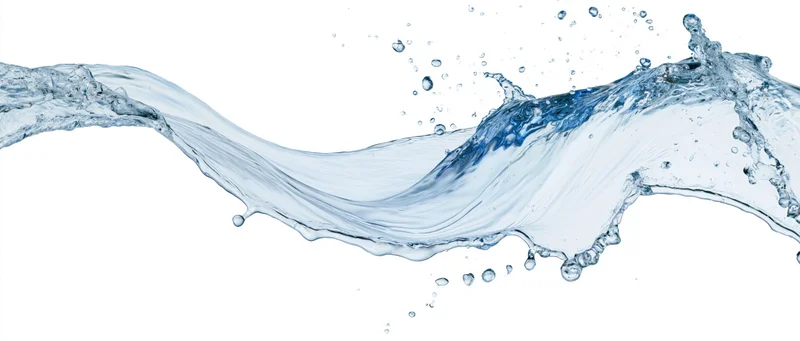 Flowing wave of clear water mid-splash isolated against white background