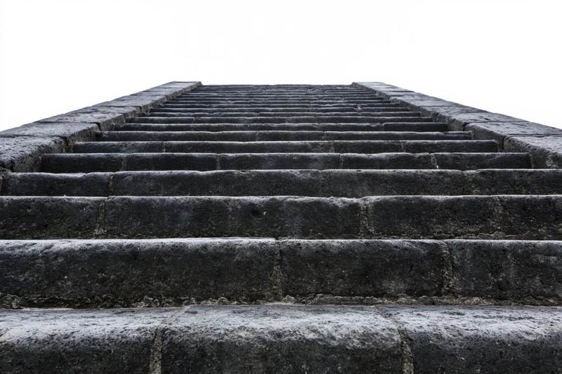 Wide stone staircase ascending upward from low angle view