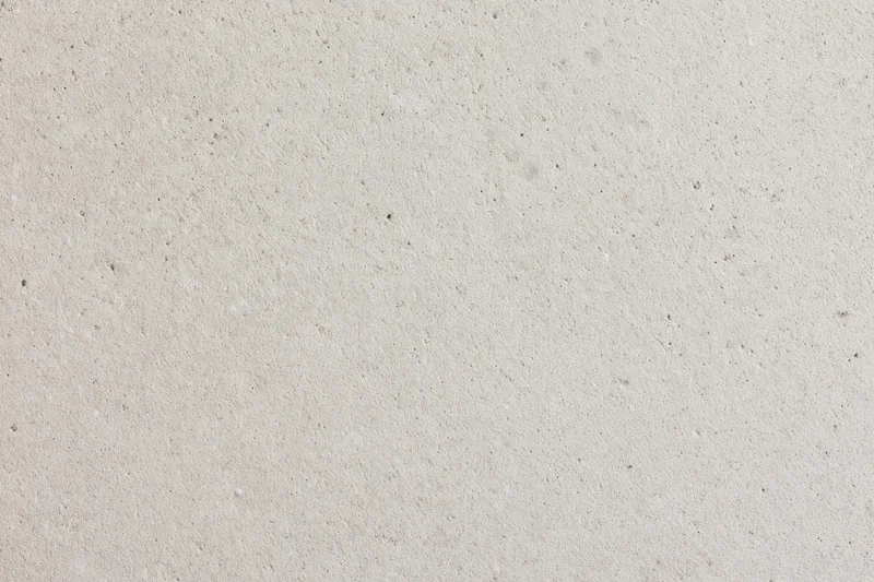 Close-up of a fine-grained concrete surface with speckled texture
