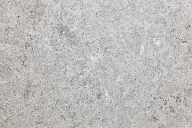 Close-up of natural grey marble stone surface with veined texture for interior design
