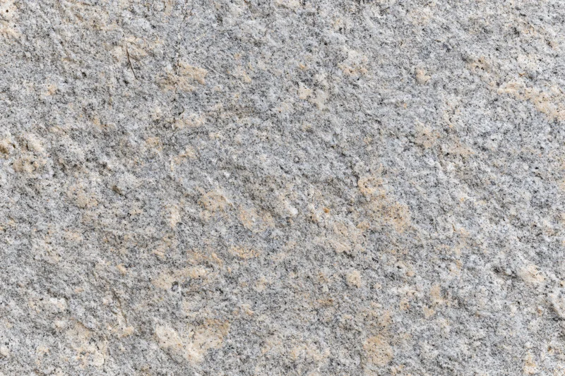 Close-up of rough granite stone surface filling the frame
