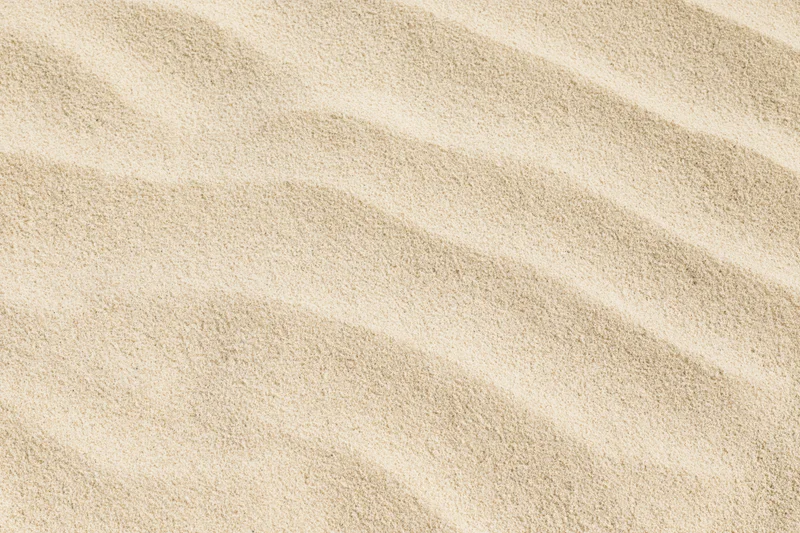Close-up of rippled dry beach sand filling the frame