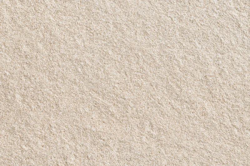 Close-up of dry beach sand filling the frame
