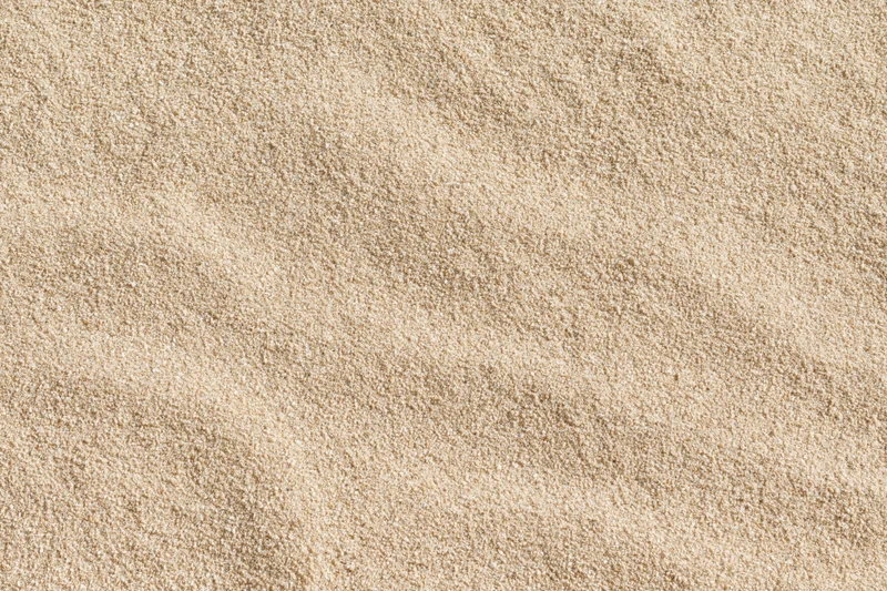 Close-up of dry beach sand filling the frame