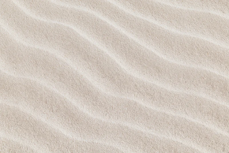 Close-up of rippled dry beach sand filling the frame