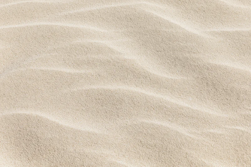 Close-up of rippled dry beach sand filling the frame