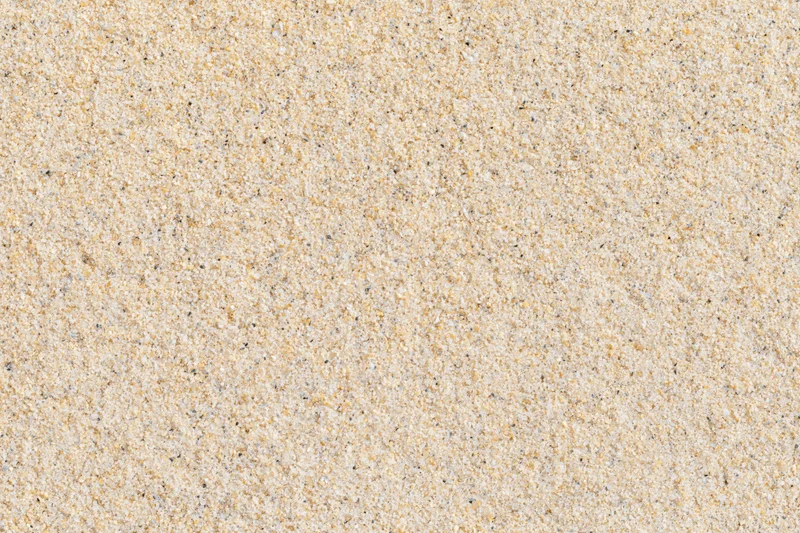 Close-up of dry beach sand surface filling the frame