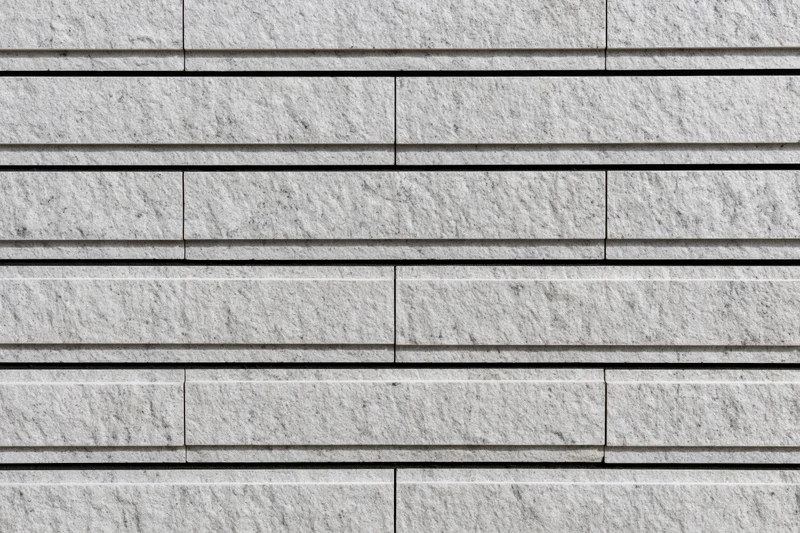 Close-up of modern stacked stone cladding on a building exterior