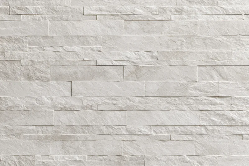 Close-up of a modern stacked stone tile wall with horizontal layers and smooth texture