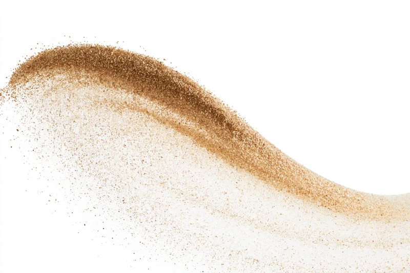 Fine desert sand in mid-air forming a sweeping arc against white background