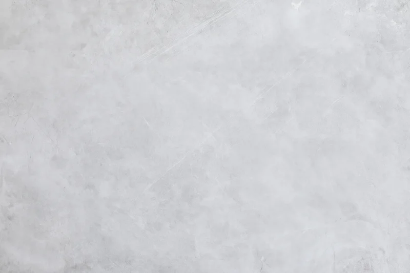 Close-up of a gray concrete wall surface with rough texture