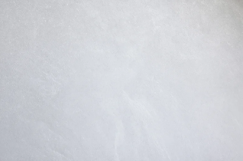 Smooth gray concrete wall surface filling the frame