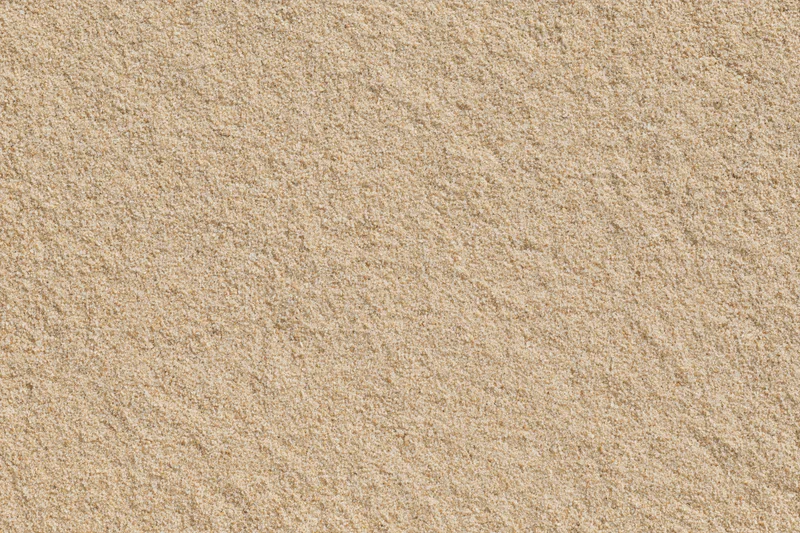 Closeup of dry beach sand texture filling the frame