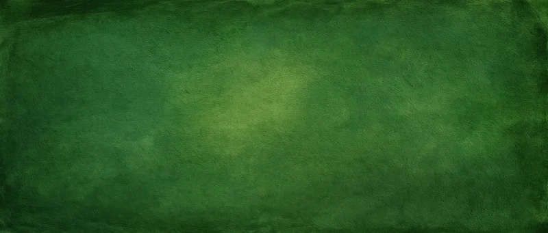 Weathered green painted wall surface filling the frame