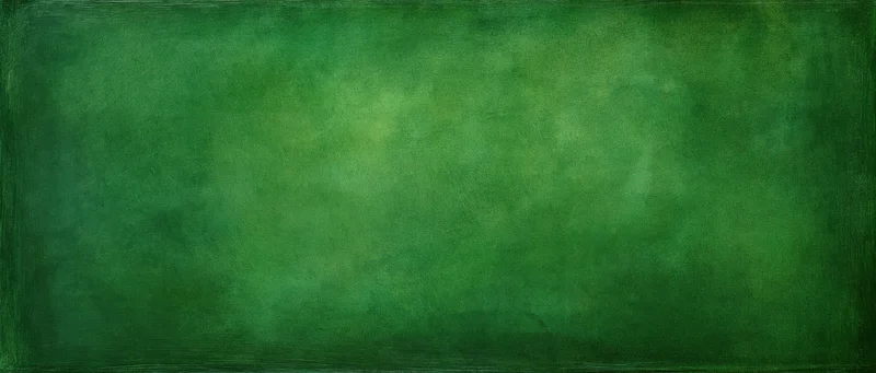 Weathered green painted wall surface filling the frame
