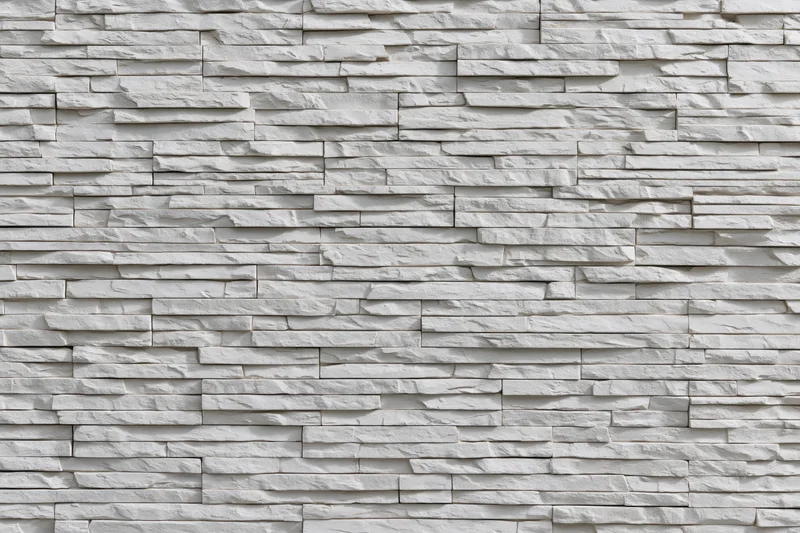 White stacked slate cladding covering a wall surface
