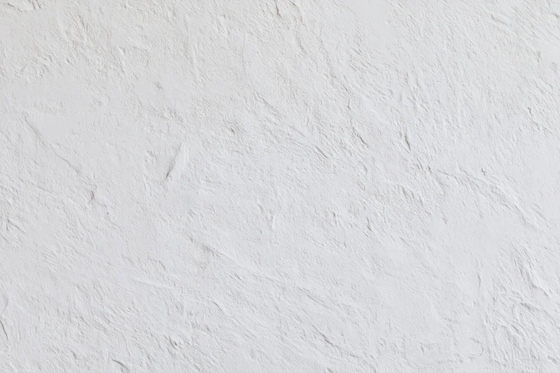 White textured plaster wall surface filling the frame