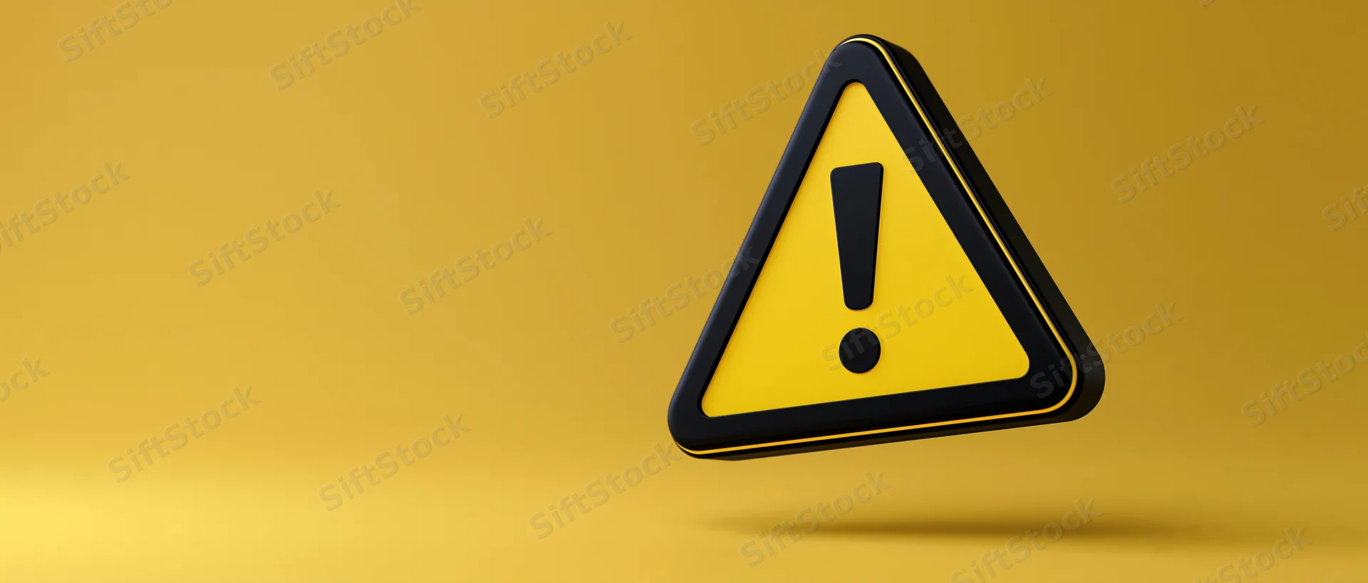 Yellow and black triangular warning sign with exclamation mark floating against a plain yellow background