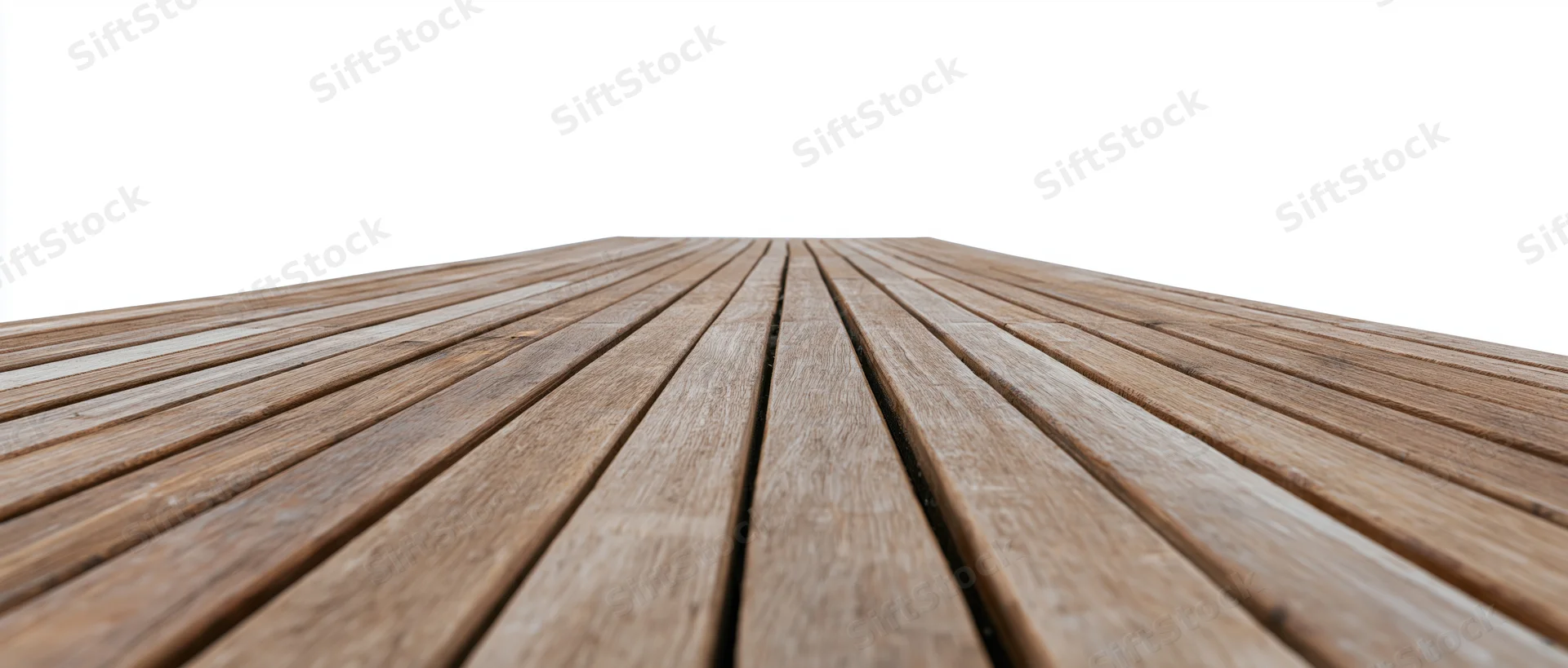 Wooden deck planks receding in perspective against white background