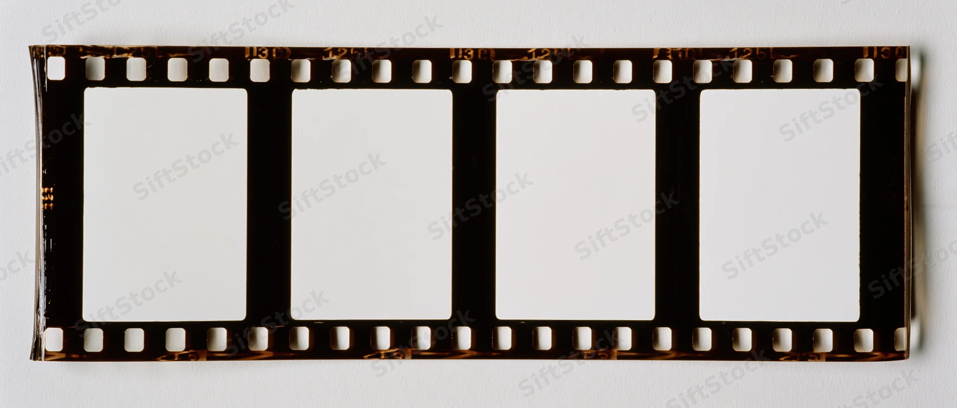 Horizontal 35mm film strip with four blank white frames on white background
