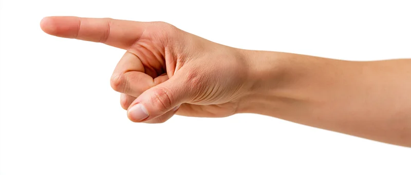 Hand pointing with index finger extended against white background