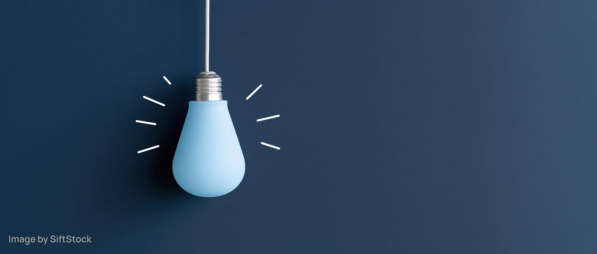 Blue lightbulb hanging from white cord against dark blue background with radiating lines suggesting illumination