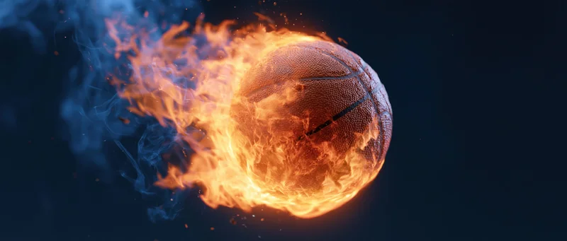 Basketball engulfed in flames against dark background