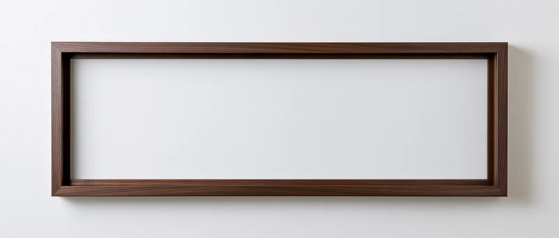 Wide rectangular wooden frame hanging on white wall with empty white interior