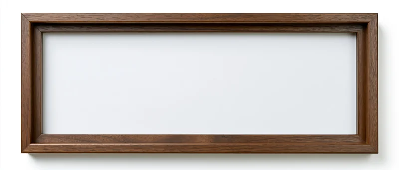 Wide rectangular wooden picture frame with empty white interior hanging on a plain wall