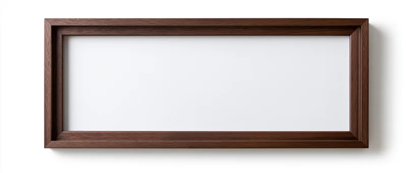 Wide rectangular wooden picture frame with empty white interior hanging on white wall