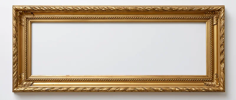 Ornate gold picture frame with intricate detailing mounted on white wall