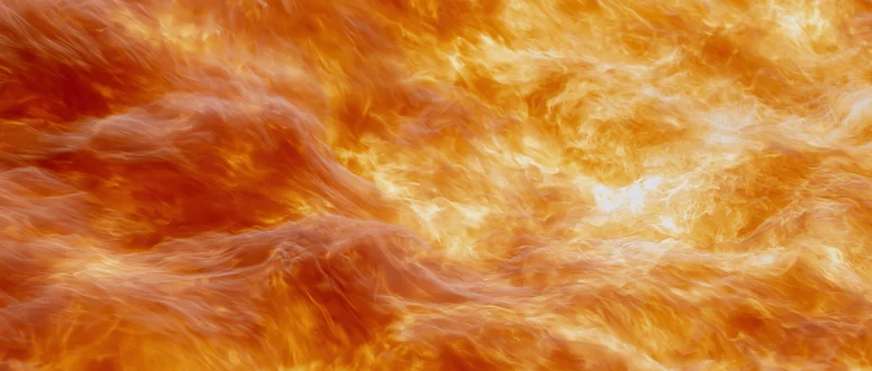 Swirling flames filling the frame in intense orange and red hues