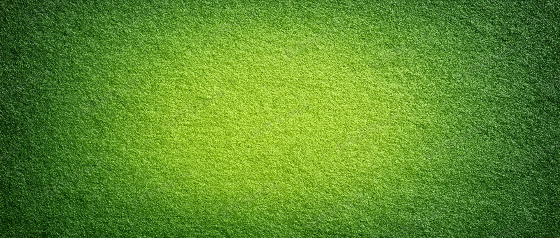 Close-up of a green textured paper surface with gradient lighting and matte finish