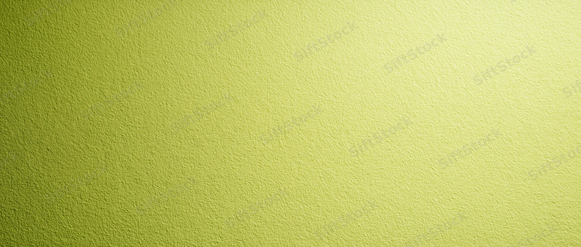 Close-up of pale lime green textured paper surface