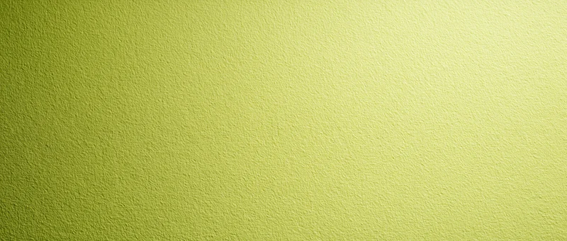 Close-up of pale lime green textured paper surface