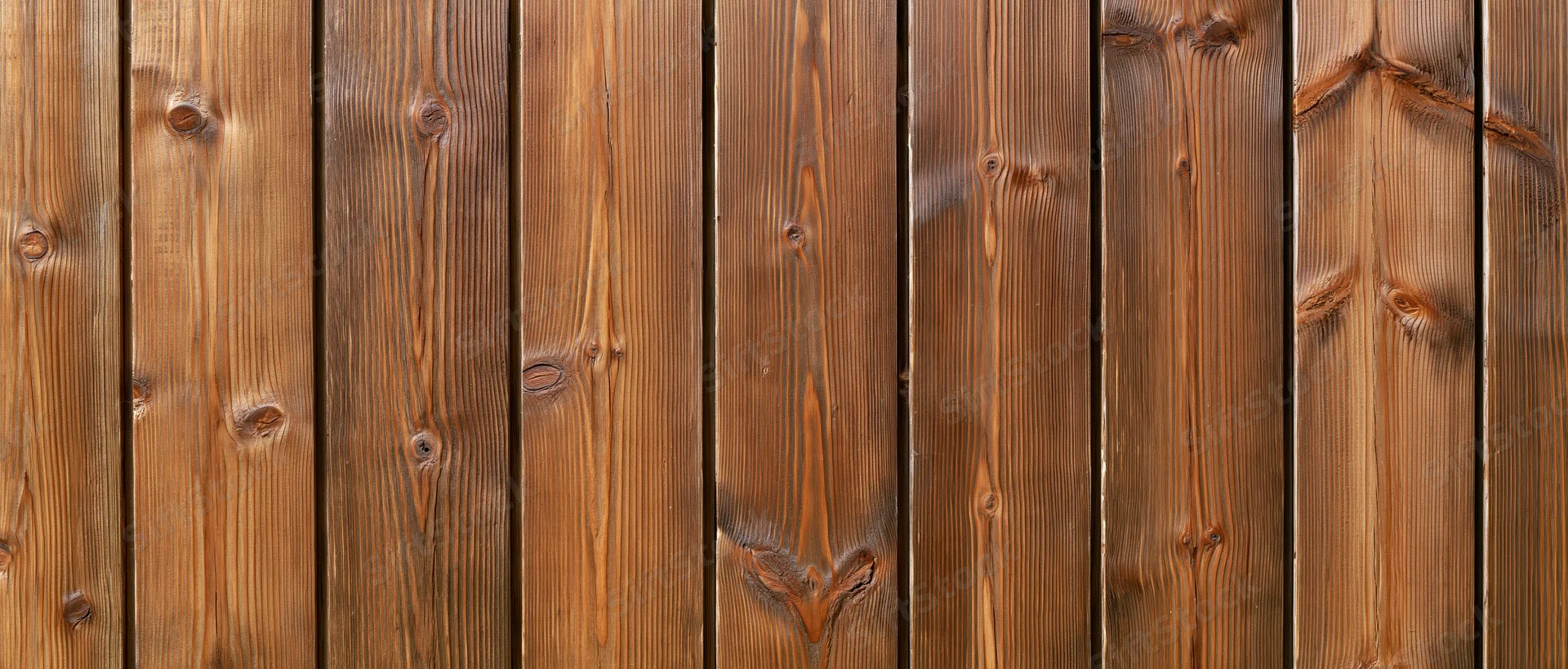 Vertical wooden planks forming a textured surface with visible grain and knots