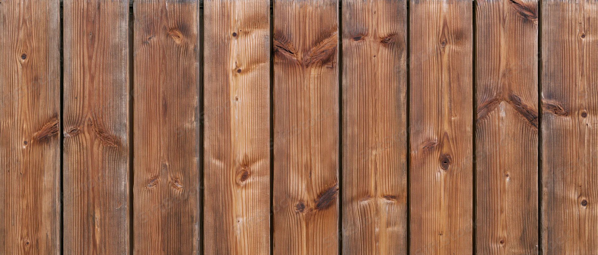 Vertical wooden planks forming a textured surface with visible grain and knots