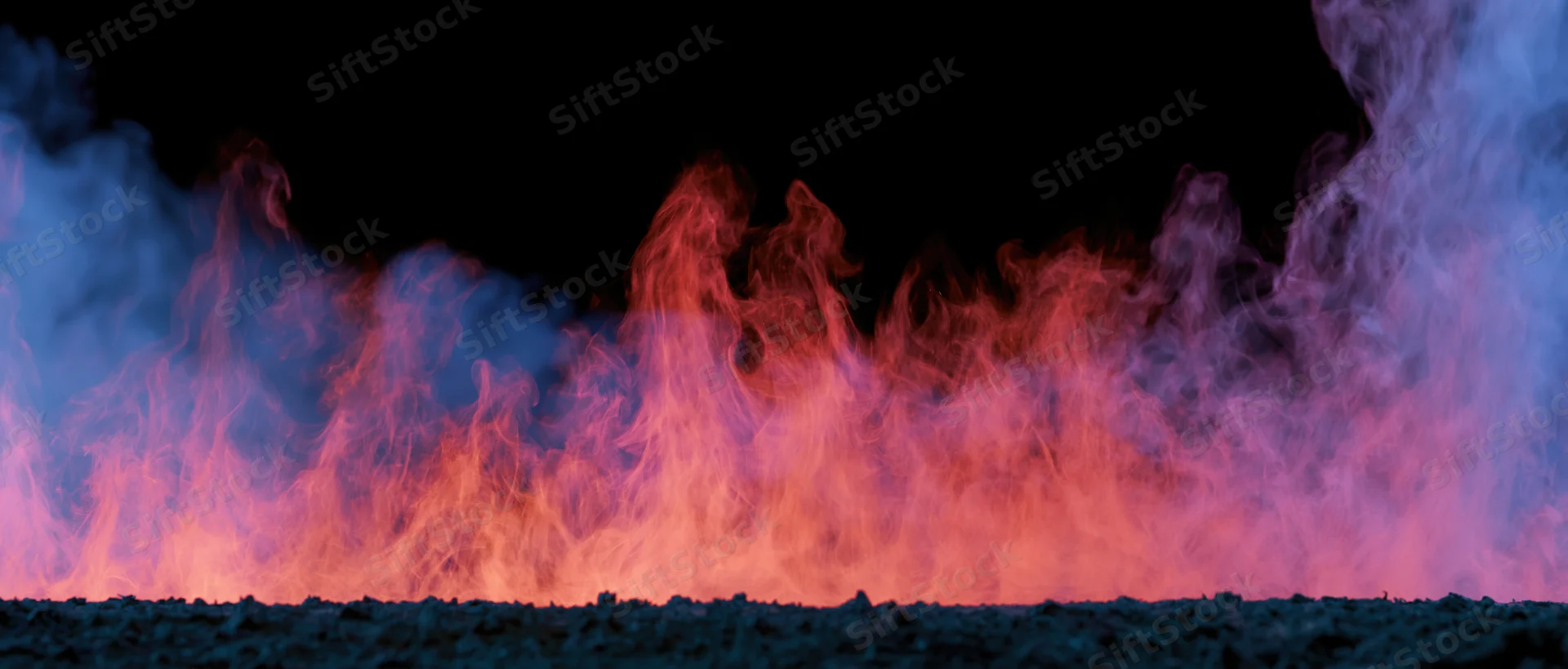Colored smoke and flame-like tendrils rising from a dark surface against a black background