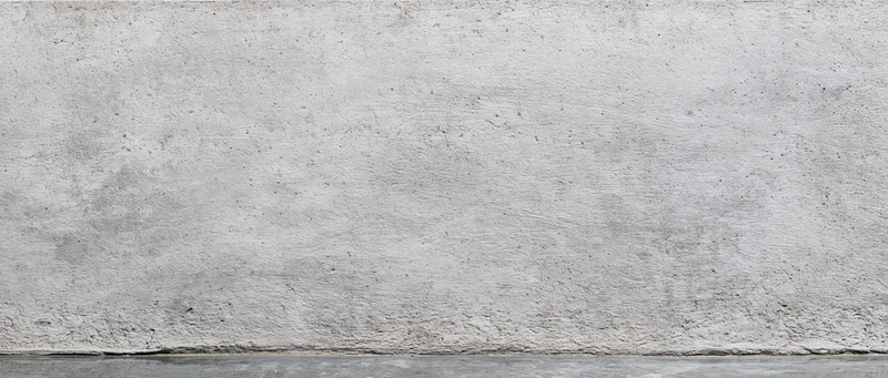 Wide flat concrete wall surface with rough texture and gray tone