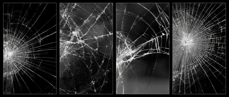 Four close-up macro views of shattered glass panels showing radial cracks and fracture patterns against black background