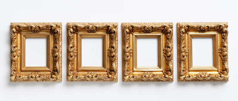 Four ornate gold picture frames arranged side by side against a white background