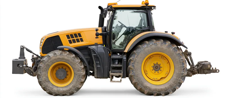 Large modern agricultural tractor in profile view isolated on white background