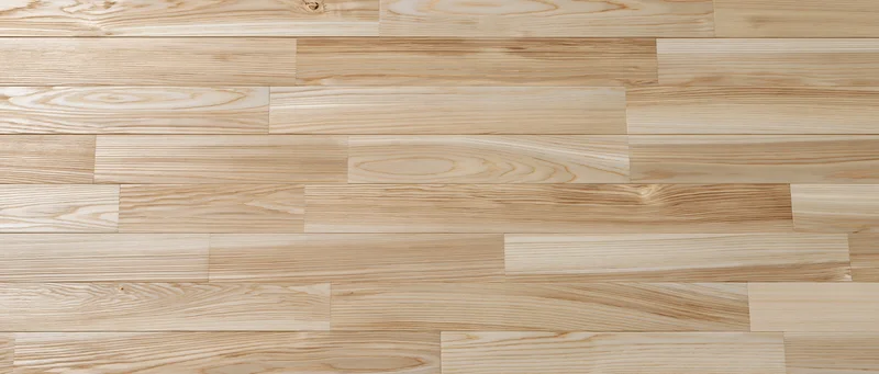 Light natural ash wood parquet flooring in flat lay overhead view