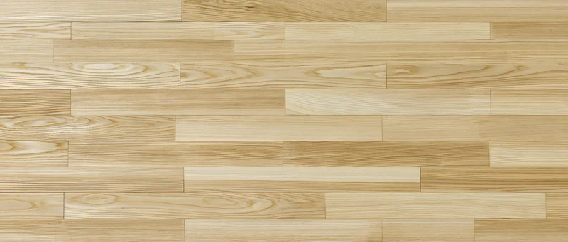 Light natural ash wood parquet flooring in a flat lay overhead view
